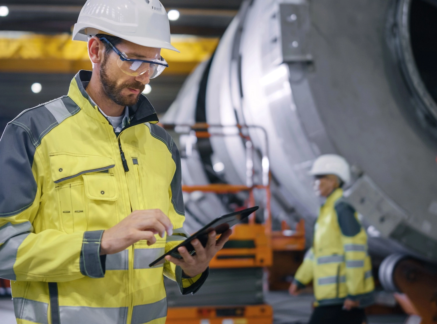 Engineer checking results from flaw detectors and MPI testing equipment