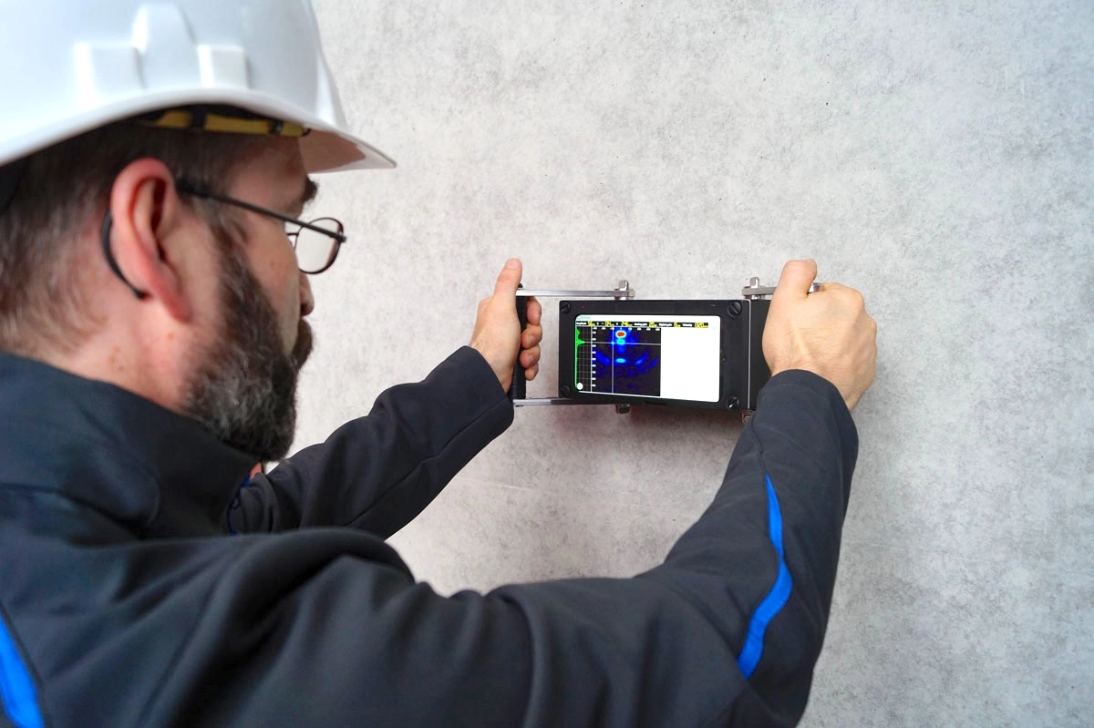 Ultrasonic testing of construction materials